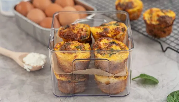 Storing high protein egg muffins in a glass meal prep container for a busy week.