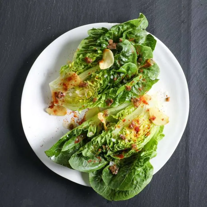 Asian-inspired toasted sourdough topped with charred little gem lettuce and peanut butter dressing.